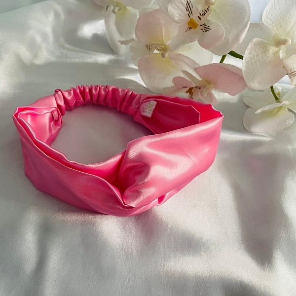 Bandeau torsadé en satin enfant rose